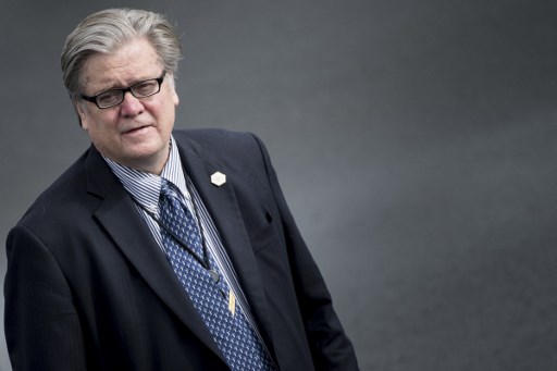 (FILES) This file photo taken on May 13, 2017 shows trategist Steve Bannon waiting while US President Donald Trump arrives at Lynchburg Regional Airport May 13, 2017 in Lynchburg, Virginia.
President Donald Trump has moved to dismiss his far-right chief strategist Steve Bannon, as the White House reels from the fallout over Trump's response to a violent white supremacist rally, The New York Times reported Friday. / AFP PHOTO / Brendan Smialowski