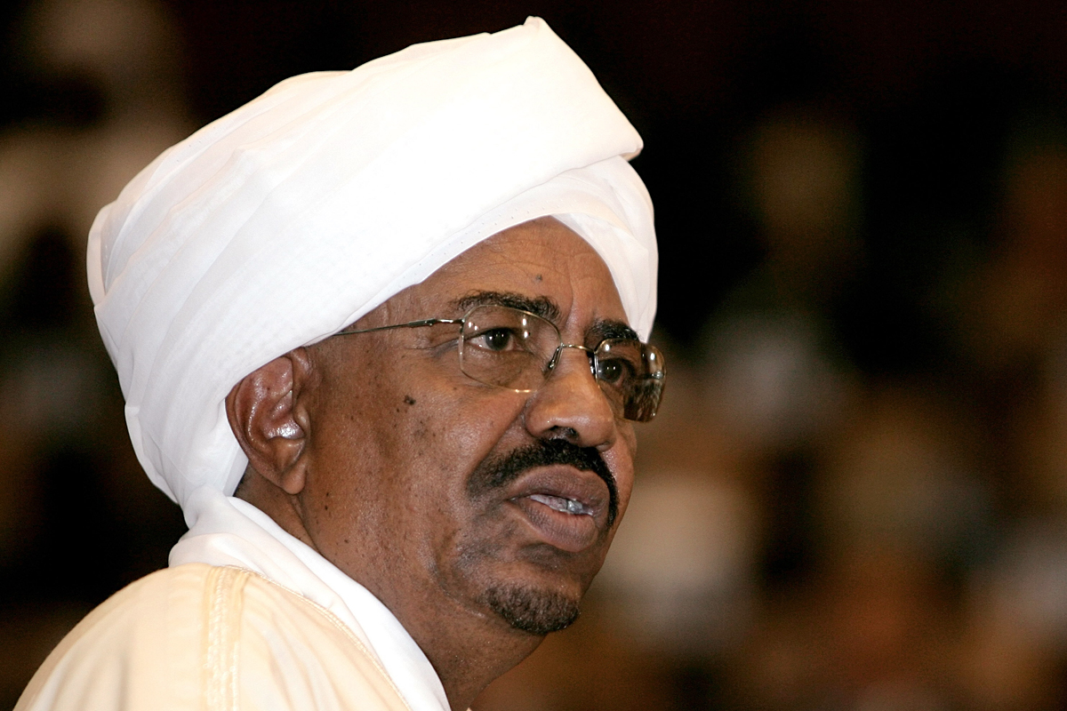 Sudanese President Omar al-Beshir delivers a speech during his swearing in ceremony at the parliament in Khartoum on May 27, 2010. Beshir, who last month won a multi-party election 21 years after seizing power in a military coup, vowed to engage with the West despite an International Criminal Court warrant hanging over him, as he was sworn in to a new five-year term. AFP PHOTO/ASHRAF SHAZLY (Photo credit should read ASHRAF SHAZLY/AFP/Getty Images)