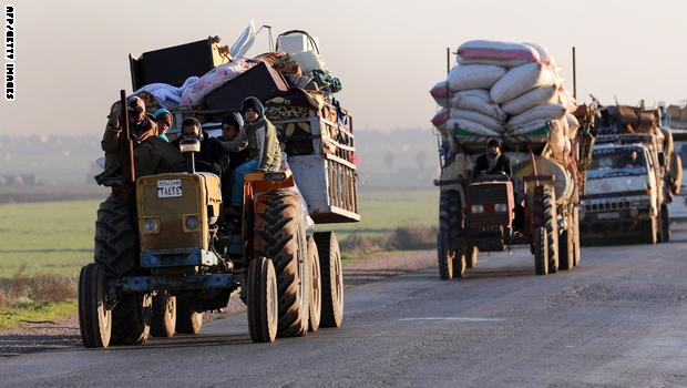 Displaced Syrians who fled the fighting in Idlib province's southeastern town of Sinjar drive on a road in a rebel-held area near the city of Saraqib on January 7, 2018.
Syrian troops captured Sinjar, the "biggest town in southeast Idlib", from Syria's former Al-Qaeda affiliate and were within 14 kilometres (9 miles) of the Abu al-Duhur military base, the British-based Syrian Observatory for Human Rights said. / AFP PHOTO / OMAR HAJ KADOUR (Photo credit should read OMAR HAJ KADOUR/AFP/Getty Images)