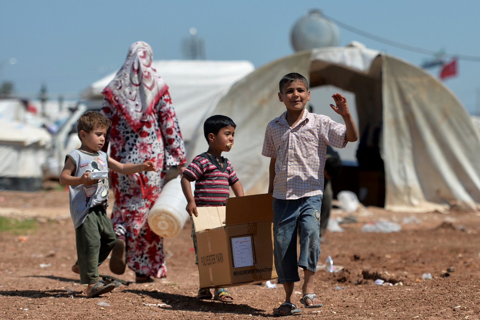 Internally displaced Syrian families spend their day at the Maiber al-Salam refugee camp along the Turkish border in the northern province of Aleppo on April 28, 2013. The number of Syrians who have fled their conflict-ravaged homeland has surpassed 1.4 million, the United Nations refugee agency said, warning that it was no longer able to meet their medical needs. AFP PHOTO /MIGUEL MEDINA (Photo credit should read MIGUEL MEDINA/AFP/Getty Images)