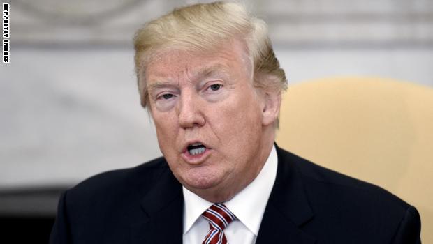 WASHINGTON, D.C. - FEBRUARY 9: (AFP-OUT) US President Donald Trump speaks in the Oval Office of the White House, February 9, 2018 in Washington, DC. President Donald Trump gave a $10,000 check to Don Bouvet's son, Shane Bouvet, a 24-year-old courier for FedEx to pay for his father's chemotherapy bills. (Photo by Olivier Douliery-Pool/Getty Images)