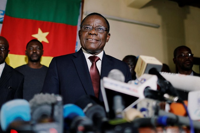 Maurice Kamto of Renaissance Movement (MRC) smiles as he holds a news conference at his headquarter in Yaounde, Cameroon October 8, 2018. REUTERS/Zohra Bensemra