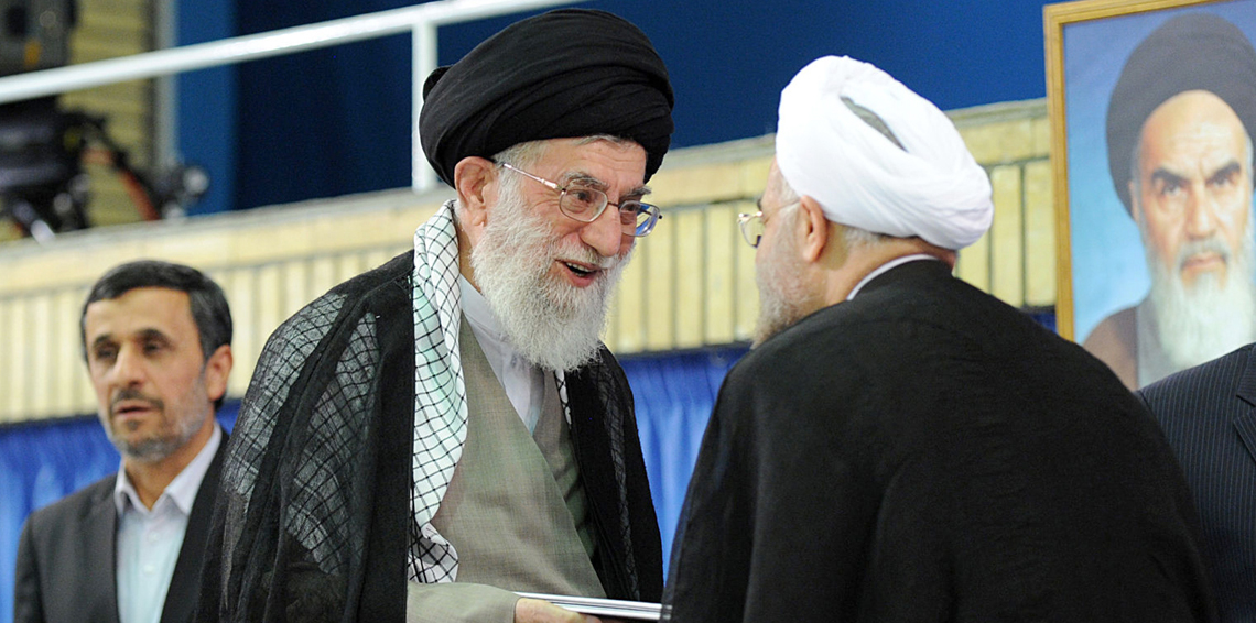 A handout picture released by the official website of the Iranian supreme leader Ayatollah Ali Khamenei on August 3, 2013, shows Khamenei (C) officially endorsing moderate cleric Hassan Rowhani (R) during a ceremony in the capital Tehran, as former president Mahmoud Ahmadinejad (L) stands by. The 64-year-old cleric begins his term as the Islamic republic's seventh president facing grave challenges abroad and at home over Irans ailing economy and isolation resulting from the controversial policies of his predecessor, Ahmadinejad. AFP PHOTO/HO/KHAMENEI.IR === RESTRICTED TO EDITORIAL USE - MANDATORY CREDIT "AFP PHOTO / HO / KHAMENEI.IR" - NO MARKETING NO ADVERTISING CAMPAIGNS - DISTRIBUTED AS A SERVICE TO CLIENTS ====