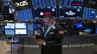 Traders work on the floor of the New York Stock Exchange (NYSE) during morning trading on January 3, 2024, in New York City. Wall Street stocks slumped to start Wednesday with all three major US indices in the red and key names such as Facebook parent Meta Platforms and Nvidia falling. (Photo by ANGELA WEISS / AFP)