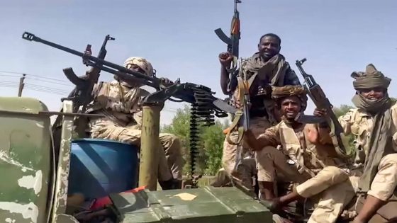 (FILES) In this image grab taken from handout video footage released by the Sudanese paramilitary Rapid Support Forces (RSF) on April 23, 2023, fighters ride in the back of a technical vehicle (pickup truck mounted with a turret) in the East Nile district of greater Khartoum. Since it erupted in 2023, Sudan has been torn apart by the war between the RSF and the army, fueled by competing regional interests including from the United Arab Emirates, Egypt, Saudi Arabia and Iran. Foreign mercenaries have appeared on both sides of the war. (Photo by Rapid Support Forces (RSF) / AFP) / === RESTRICTED TO EDITORIAL USE - MANDATORY CREDIT "AFP PHOTO / HO / SUDAN RAPID SUPPORT FORCES (RSF)" - NO MARKETING NO ADVERTISING CAMPAIGNS - DISTRIBUTED AS A SERVICE TO CLIENTS ===