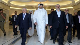 A handout picture released by the Palestinian president's office (PPO) shows Palestinian president Mahmud Abbas (C-L) meeting with Emir of Qatar Sheikh Tamim Bin Hamad al-Thani (C) and Hamas exiled leader Khaled Meshaal (C-R) in the capital Doha on August 21, 2014. AFP PHOTO/ PPO / THAER GHANEM
=== RESTRICTED TO EDITORIAL USE - MANDATORY CREDIT "AFP PHOTO/ PPO / THAER GHANEM" - NO MARKETING NO ADVERTISING CAMPAIGNS - DISTRIBUTED AS A SERVICE TO CLIENTS === (Photo by HO / AFP)
