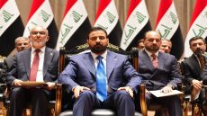 This handout picture released by the Iraqi Prime Minister's Press Office shows new prime minister-designate Ali al-Zaidi (C) sitting ahead of presenting his government to the parliament in Baghdad on May 14, 2026. Iraqi lawmakers approved a new government on May 14 led by businessman Ali al-Zaidi, who took office after months of deadlock and mounting US pressure. (Photo by IRAQI PRIME MINISTER'S PRESS OFFICE / AFP) / RESTRICTED TO EDITORIAL USE - MANDATORY CREDIT "AFP PHOTO / IRAQI PRIME MINISTER'S PRESS OFFICE / HANDOUT / " - NO MARKETING NO ADVERTISING CAMPAIGNS - DISTRIBUTED AS A SERVICE TO CLIENTS