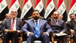 This handout picture released by the Iraqi Prime Minister's Press Office shows new prime minister-designate Ali al-Zaidi (C) sitting ahead of presenting his government to the parliament in Baghdad on May 14, 2026. Iraqi lawmakers approved a new government on May 14 led by businessman Ali al-Zaidi, who took office after months of deadlock and mounting US pressure. (Photo by IRAQI PRIME MINISTER'S PRESS OFFICE / AFP) / RESTRICTED TO EDITORIAL USE - MANDATORY CREDIT "AFP PHOTO /  IRAQI PRIME MINISTER'S PRESS OFFICE / HANDOUT /  " - NO MARKETING NO ADVERTISING CAMPAIGNS - DISTRIBUTED AS A SERVICE TO CLIENTS