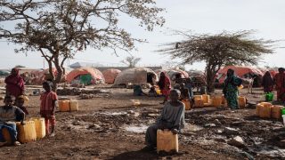 (FILES) In this file photo taken on February 13, 2022 People wait for water with containers at a camp, one of the 500 camps for internally displaced persons (IDPs) in town, in Baidoa, Somalia. - Millions of people in Somalia are at risk of famine, with young children the most vulnerable to the worsening drought in the troubled Horn of Africa nation, UN agencies warned on April 12, 2022.
"Somalia is facing famine conditions as a perfect storm of poor rain, skyrocketing food prices and huge funding shortfalls leaves almost 40 percent of Somalis on the brink," the agencies said in a statement. (Photo by YASUYOSHI CHIBA / AFP)