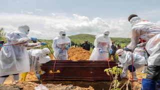 Red Cross workers bury an Ebola victim at the Rwampara Cemetery, in Rwampara, Congo, Saturday, May 23, 2026. (AP Photo/Moses Sawasawa) CORRECTION: City corrected to Rwampara, instead of Bunia