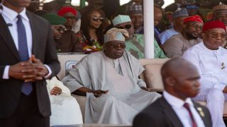 epa12740366 Nigeria’s President Bola Tinubu (C) attends  the Argungu Fishing Festival in Argungu, Kebbi State, Nigeria, 14 February 2026. The centuries-old cultural event brings together thousands of fishermen from across northern Nigeria and neighbouring countries. It is a mass fishing competition in the Matan Fada River, where participants, using only traditional tools such as handmade nets and gourds, race to catch the largest fish within a limited time.  EPA/EMMANUEL ADEGBOYE