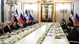 epa12455784 Russian President Vladimir Putin and Syrian interim President Ahmed al-Sharaa attend an expanded format meeting at the Kremlin in Moscow, Russia, 15 October 2025.  EPA/SERGEY BOBYLEV/SPUTNIK/KREMLIN POOL