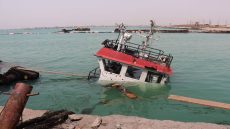 The navigation bridge of a sunken vessel is all that is seen at the surface of the water in the Port of Mokha the day after an attack by the Houthis on the city Mokha, held by Yemen's internationally recognised, Aden-based government on August 10, 2026. Strikes by Iran-backed Houthi rebels on August 9, 2026, killed at least 11 people, a medical source in the Yemeni port city of Mokha told AFP, after an earlier drone salvo targeted a Saudi oil refinery on the Red Sea coast. A years-long truce in Yemen's civil war between the Houthis and the Saudi-backed, internationally recognised government appeared to collapse last month as fighting between regional allies of the United States and Iran flared. (Photo by Khaled ZIAD / AFP) /