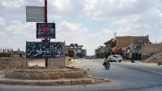 A man rides a motorbike in the town of Abu al-Duhur, Syria, August 18, 2026. REUTERS/Stringer