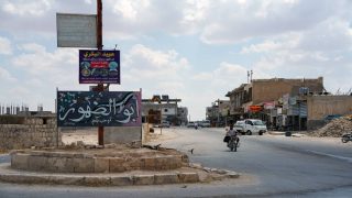 A man rides a motorbike in the town of Abu al-Duhur, Syria, August 18, 2026. REUTERS/Stringer